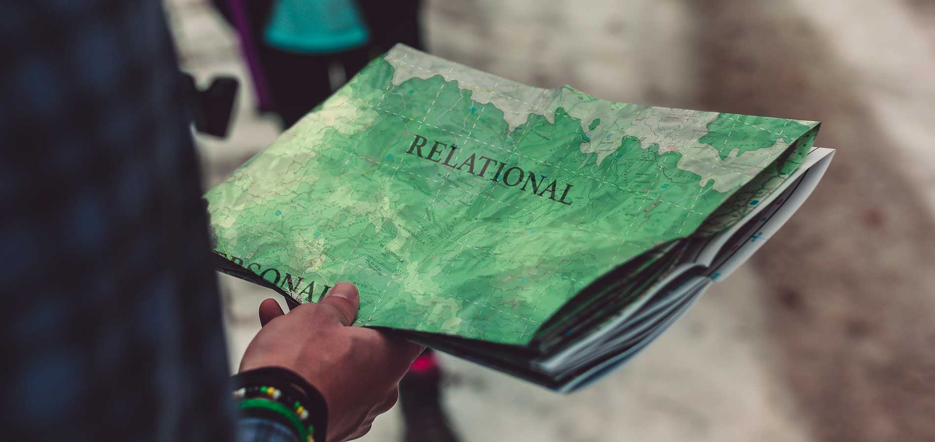 person holding a map of the region labled Personal